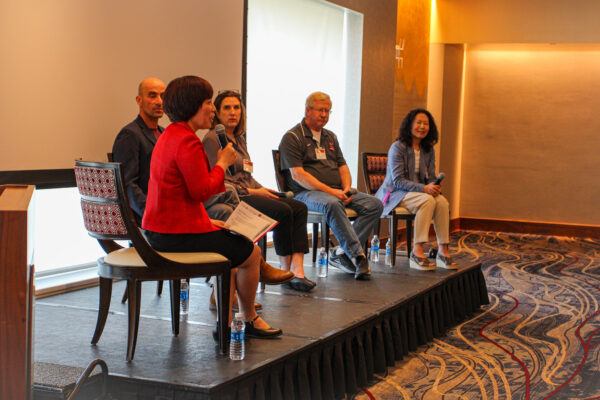 Panelists during the "Building Bridges from Scientific Discovery to Societal Impact"